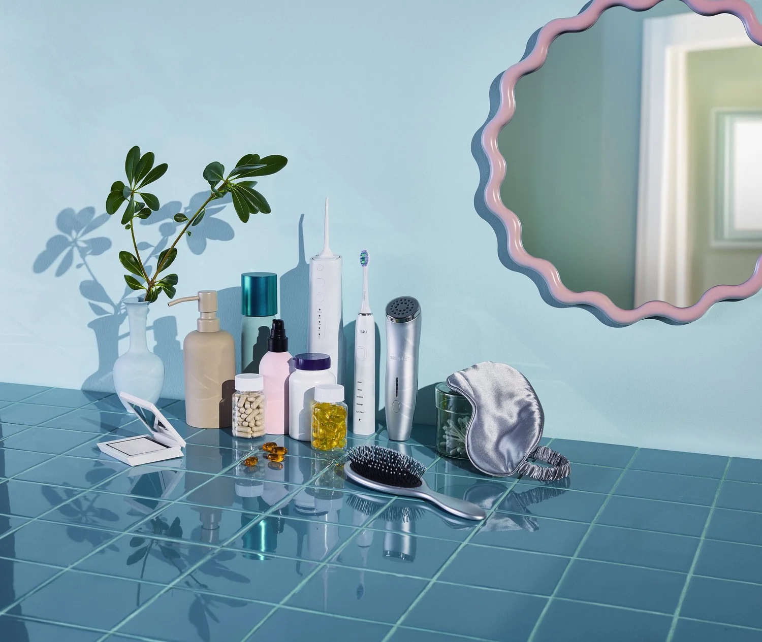 Bathroom counter with skincare items and mirror, beauty product still life photography