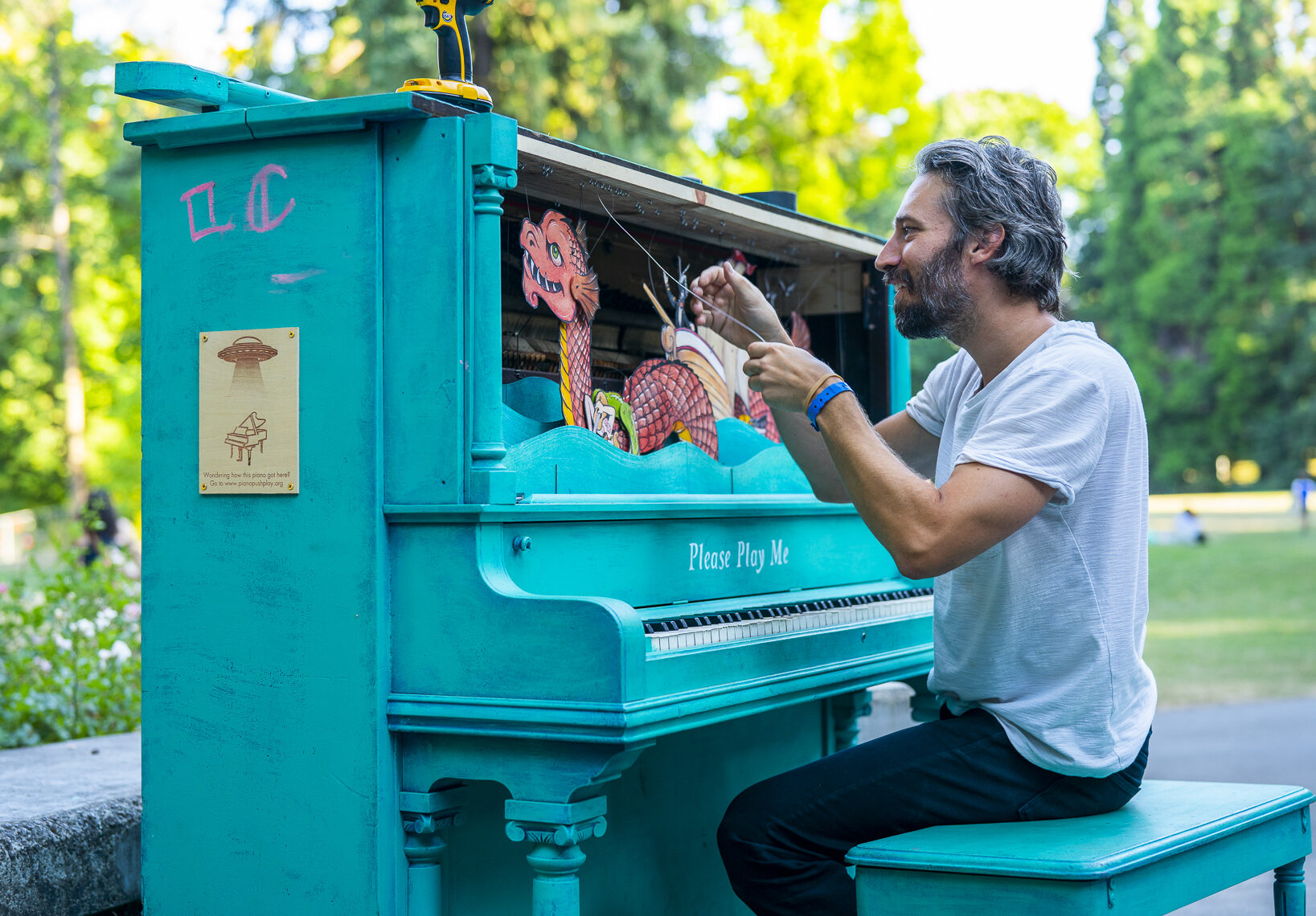 Man playing keyboard on stage or studio setup, music performance lifestyle photo