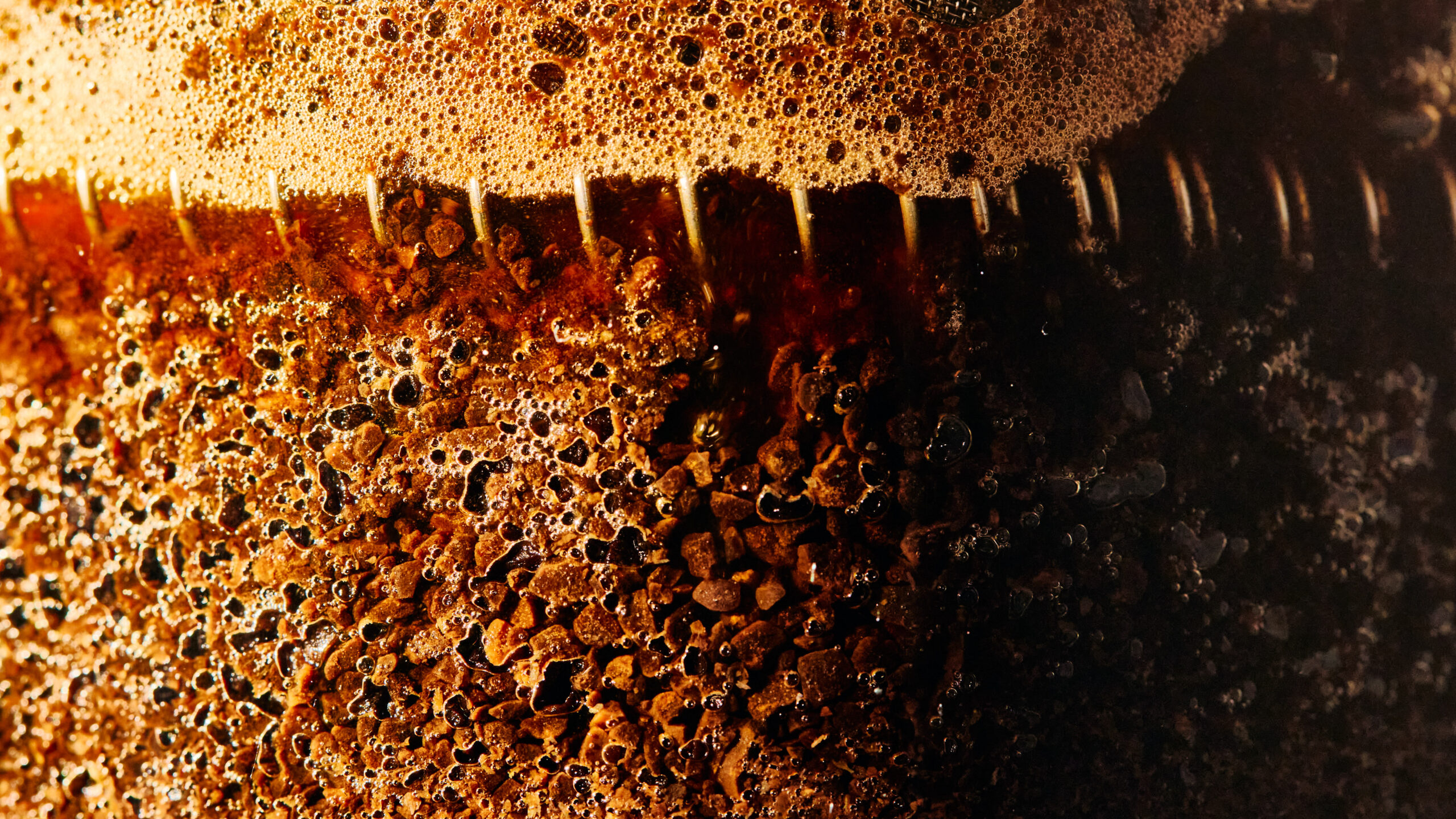 Syrup pouring over waffles or dessert in a glossy close-up food shot